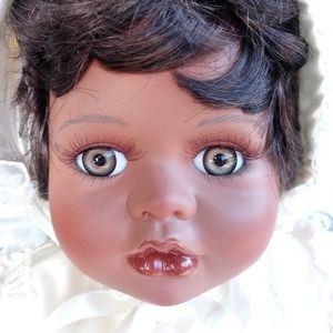 Large porcelain baby doll. Only by court of dolls
